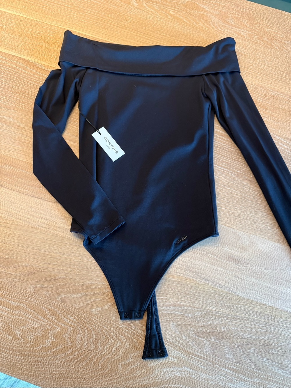 Woman’s Contour off the shoulder thong bodysuit. Brand new with tags.